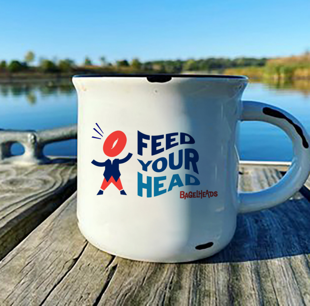 Image of a bagleheads mug with the tagline feed your head.